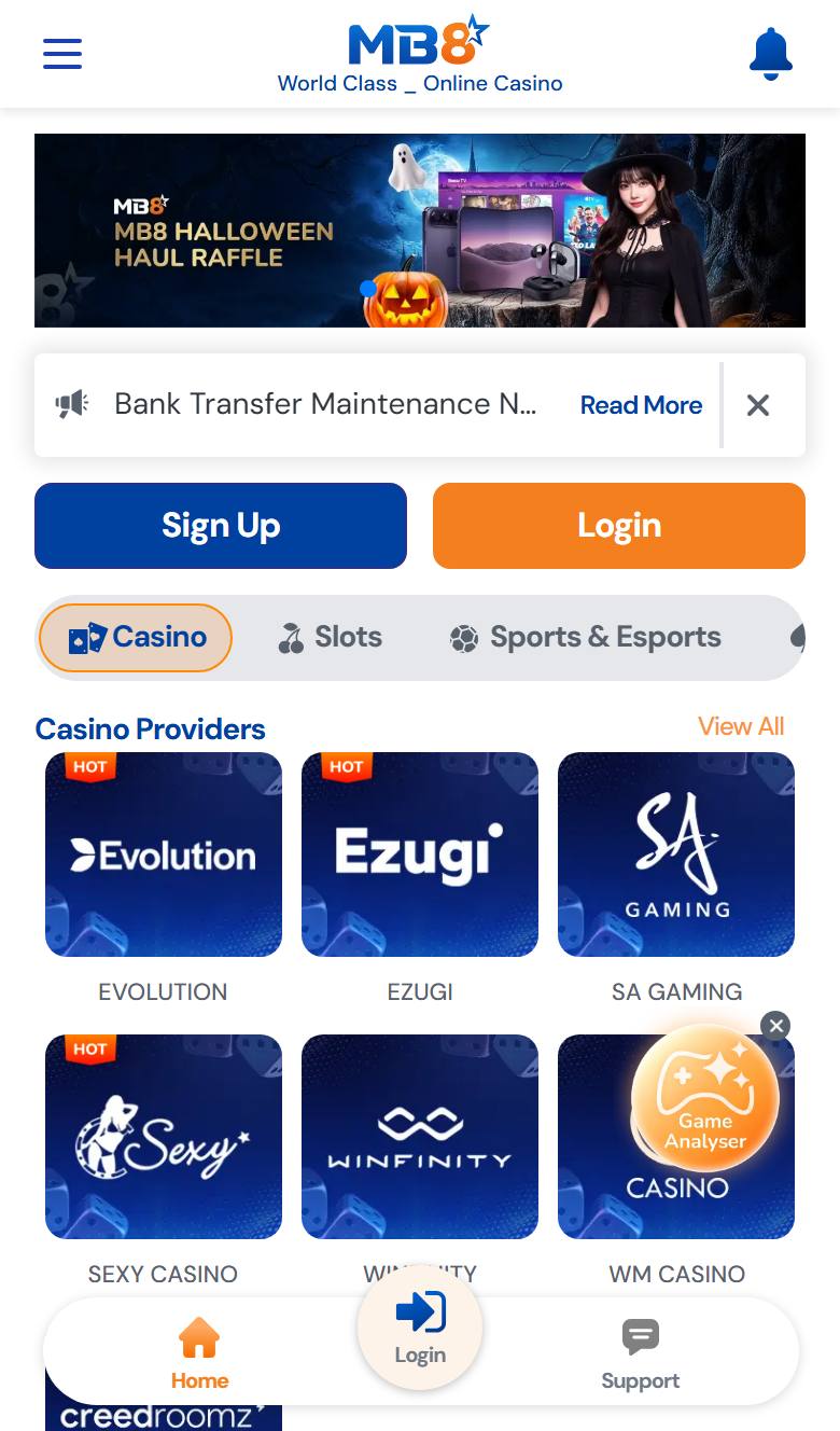 MB8 mobile site on iPhone with Halloween banner, Sign Up and Login buttons and casino provider tiles