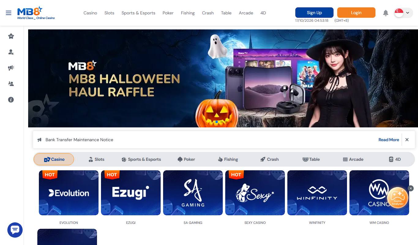 MB8 Singapore homepage with Halloween Haul Raffle banner, bank transfer maintenance notice and live casino provider tiles